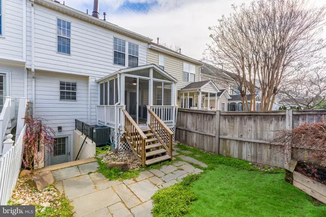 a view of a park with iron fence