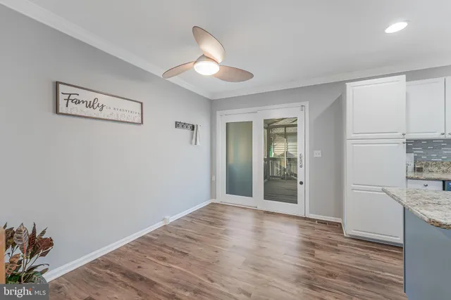 a kitchen with stainless steel appliances granite countertop a refrigerator stove microwave and sink