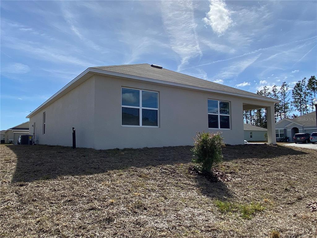 14 Hickory Course Lane Ocala, FL 34472 - Photo 19 of 20 a backyard of a house