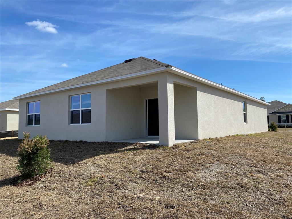 14 Hickory Course Lane Ocala, FL 34472 - Photo 20 of 20 a front view of a house with a yard