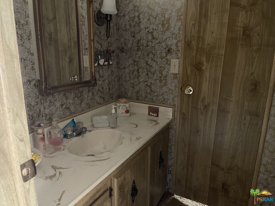 57435 Mitchell Road Anza, CA 92539 - Photo 14 of 16 a bathroom with a sink and vanity