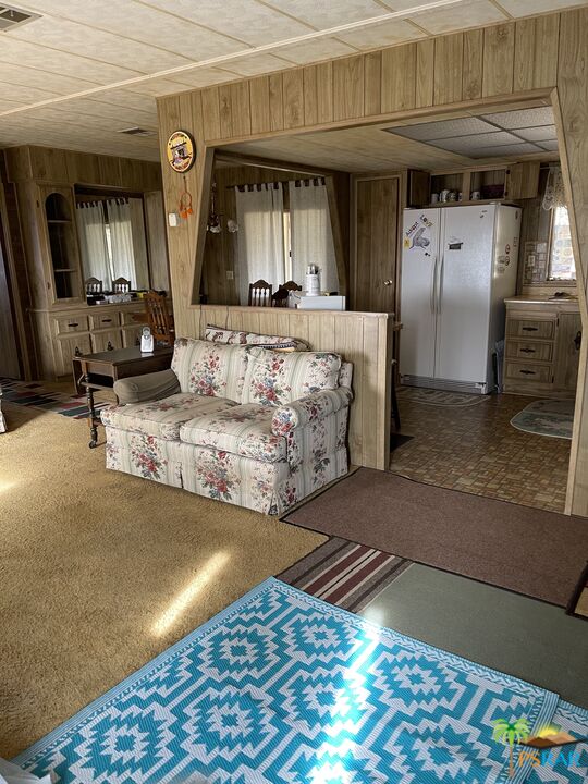 57435 Mitchell Road Anza, CA 92539 - Photo 7 of 16 a kitchen with stainless steel appliances kitchen island granite countertop a refrigerator and a stove