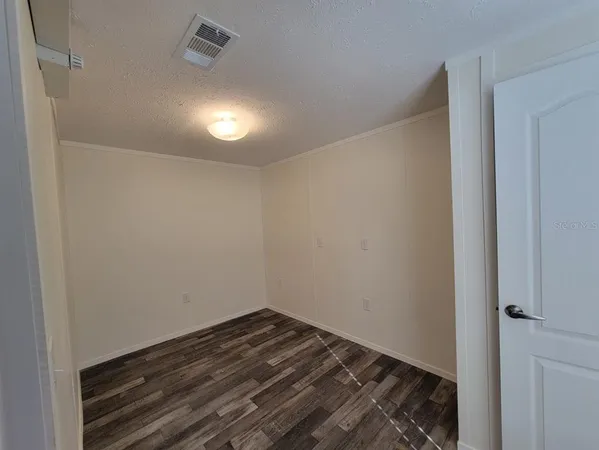 a view of small space with wooden floor