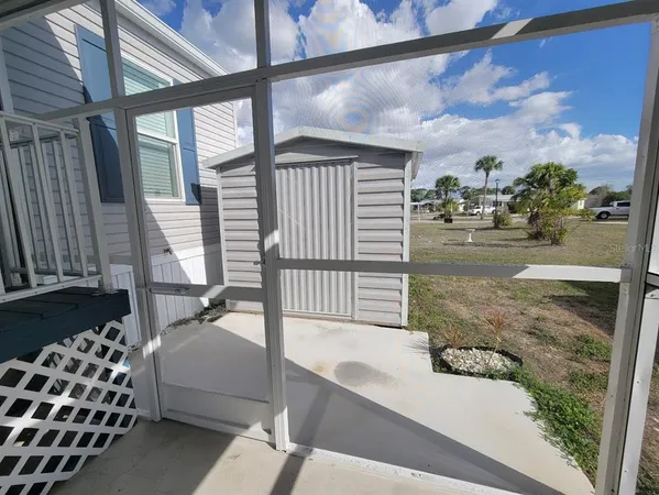 a view of balcony with a potted plant