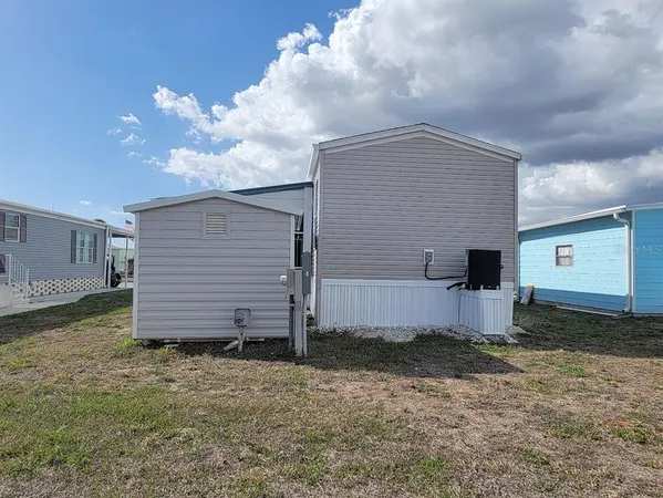 a house view with a backyard space
