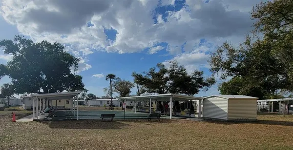 a view of a house with outdoor space and sitting area