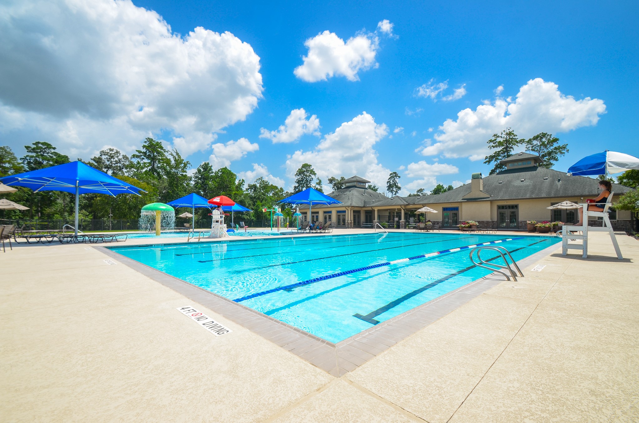 6210 Pinewood Heights Drive Spring, TX 77389 - Photo 11 of 13 a view of a house with a swimming pool and a yard