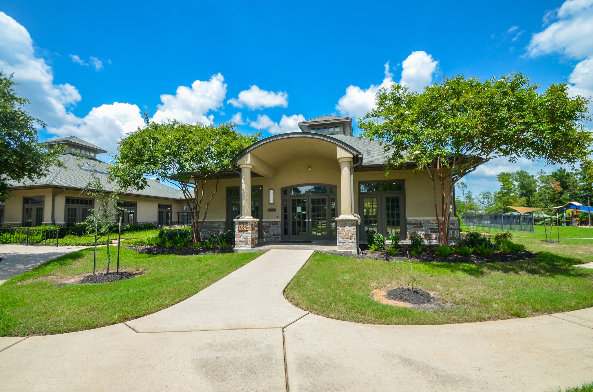 6210 Pinewood Heights Drive Spring, TX 77389 - Photo 5 of 13 a view of a house with a swimming pool and yard