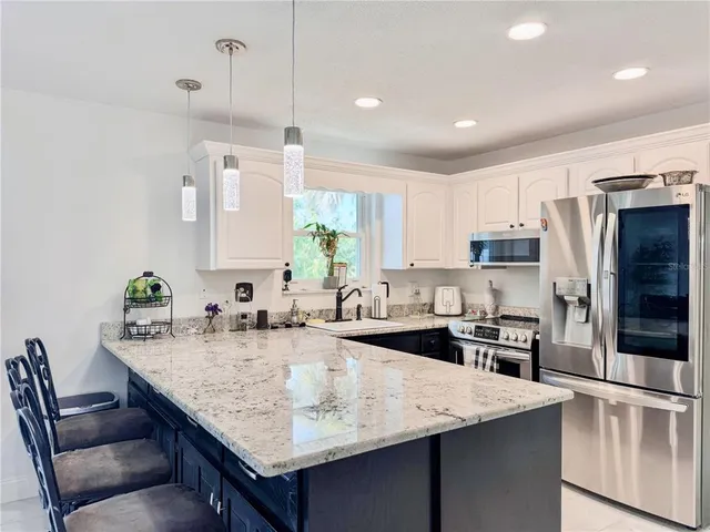 a front view of house with yard and outdoor seating