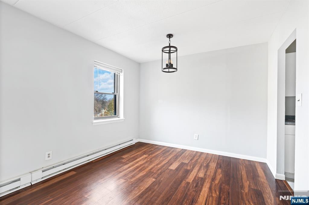 300 Lookout Avenue, Unit C4 Hackensack, NJ 07601 - Photo 11 of 18 a view of a room with wooden floor and window