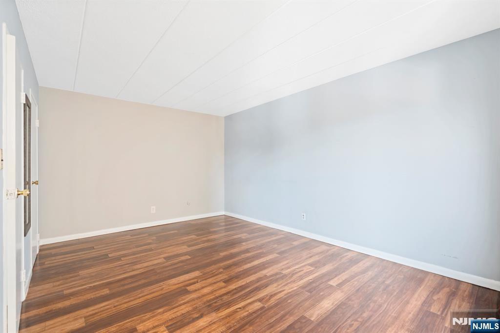 300 Lookout Avenue, Unit C4 Hackensack, NJ 07601 - Photo 16 of 18 a view of an empty room with wooden floor