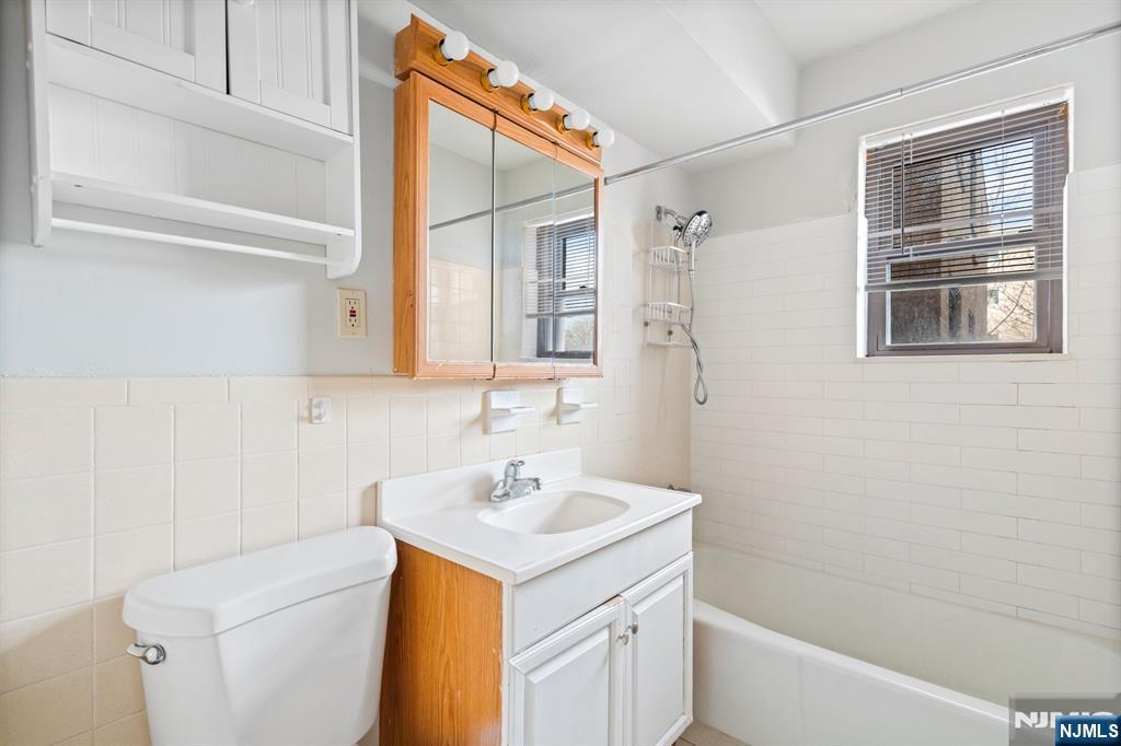 300 Lookout Avenue, Unit C4 Hackensack, NJ 07601 - Photo 18 of 18 a bathroom with a sink a bath tub and a shower