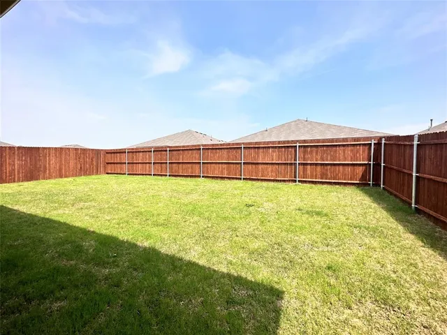 a view of a garden with a large trees