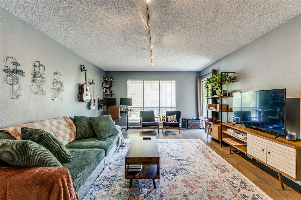 4859 Cedar Springs Road, Unit 359 Dallas, TX 75219 - Photo 1 of 1 a living room with furniture and a flat screen tv