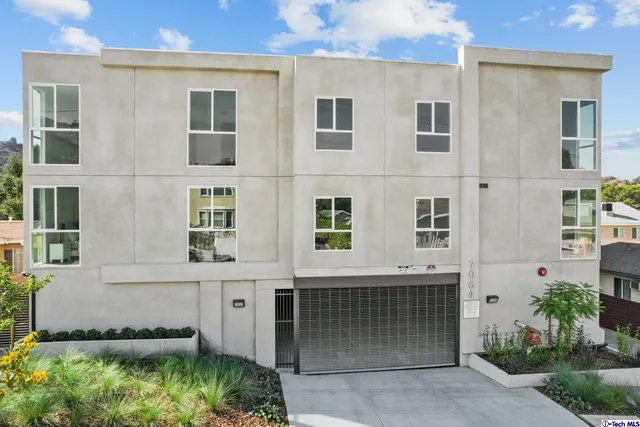 front view of a house with a garden