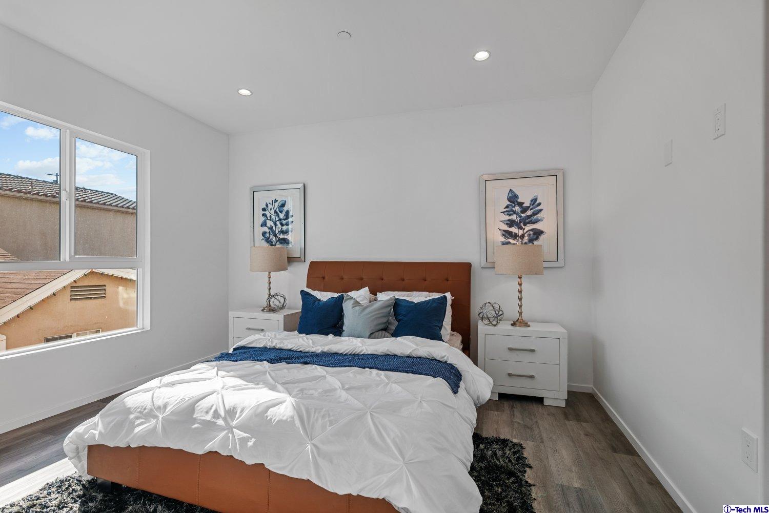 7064 Greeley Street, Unit 102 Tujunga, CA 91042 - Photo 17 of 27 a bedroom with bed and a window