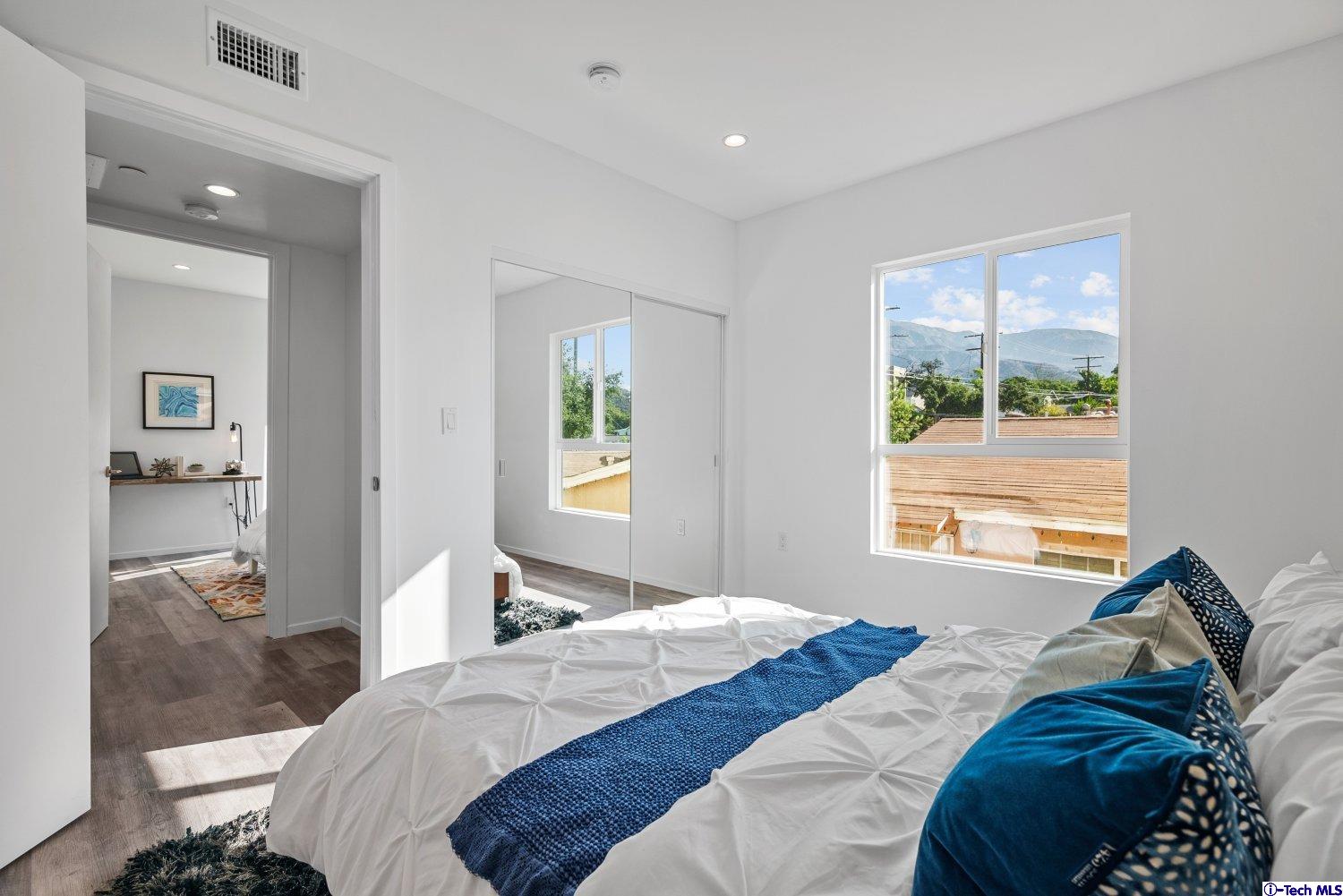 7064 Greeley Street, Unit 102 Tujunga, CA 91042 - Photo 18 of 27 a bedroom with bed and a window