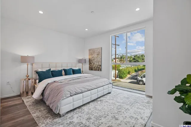 a bedroom with a bed and a couch