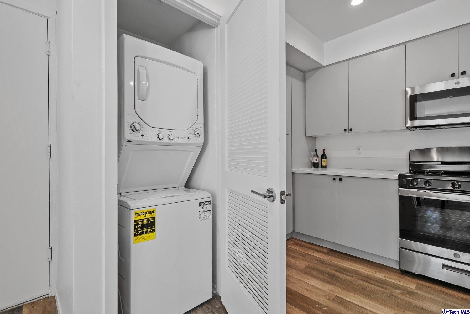 7064 Greeley Street, Unit 102 Tujunga, CA 91042 - Photo 25 of 27 a utility room with dryer and washer