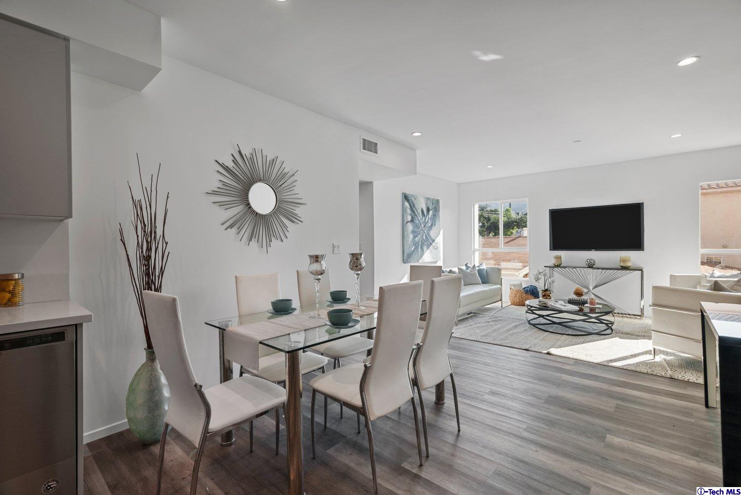 7064 Greeley Street, Unit 102 Tujunga, CA 91042 - Photo 10 of 27 a view of a dining room with furniture and wooden floor