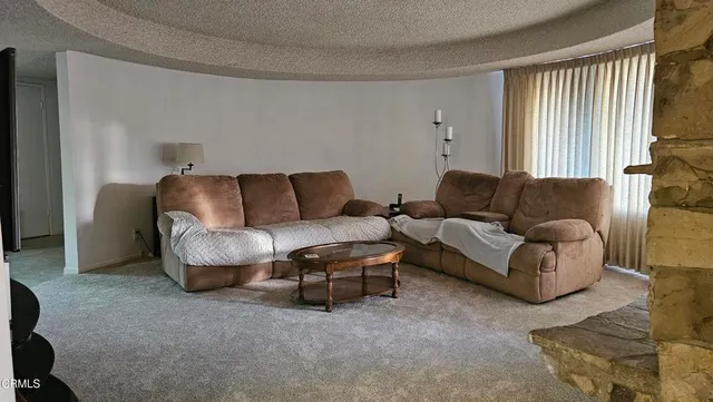 a living room with furniture and a couch