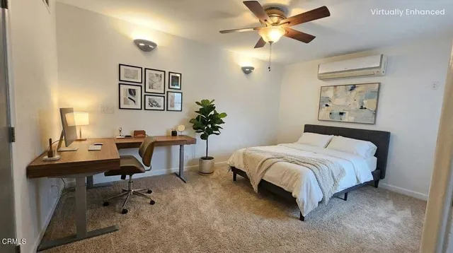 a bedroom with a bed and a desk