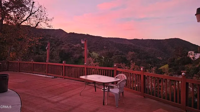 a view of a chairs on the roof deck