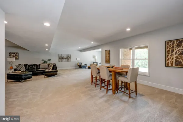 a view of a dining room with furniture and a rug