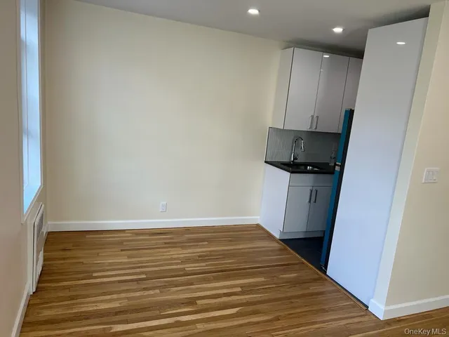 a view of a kitchen from the hallway
