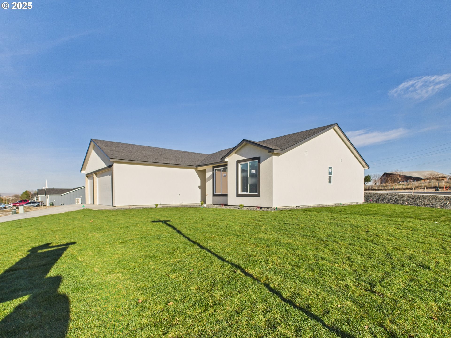 1291 Southeast 9th Street Hermiston, OR 97838 - Photo 10 of 34 a house with yard in front of it