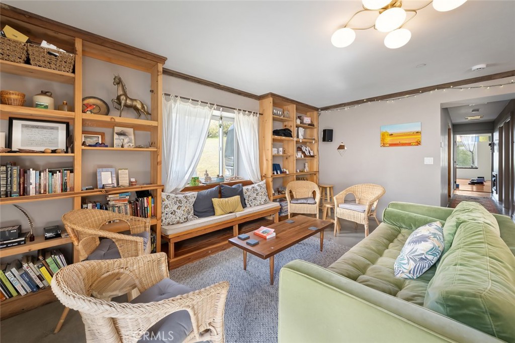 6790 West Pozo Road Santa Margarita, CA 93453 - Photo 11 of 68 a living room with furniture and a book shelf