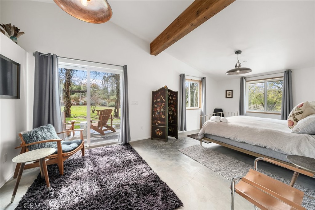 6790 West Pozo Road Santa Margarita, CA 93453 - Photo 30 of 64 a spacious bedroom with a bed and large windows