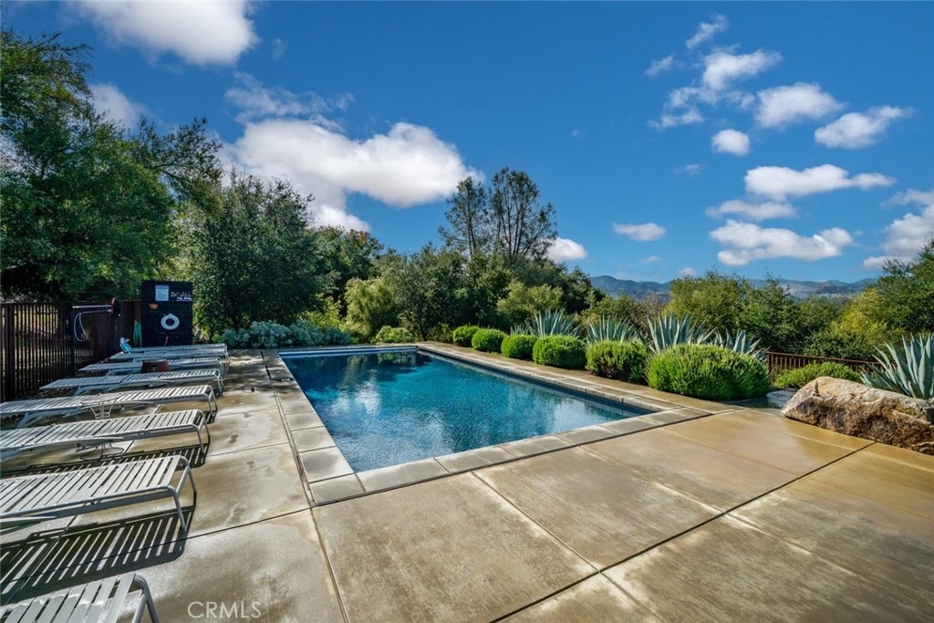 6790 West Pozo Road Santa Margarita, CA 93453 - Photo 37 of 64 a view of a swimming pool with an outdoor space and seating area
