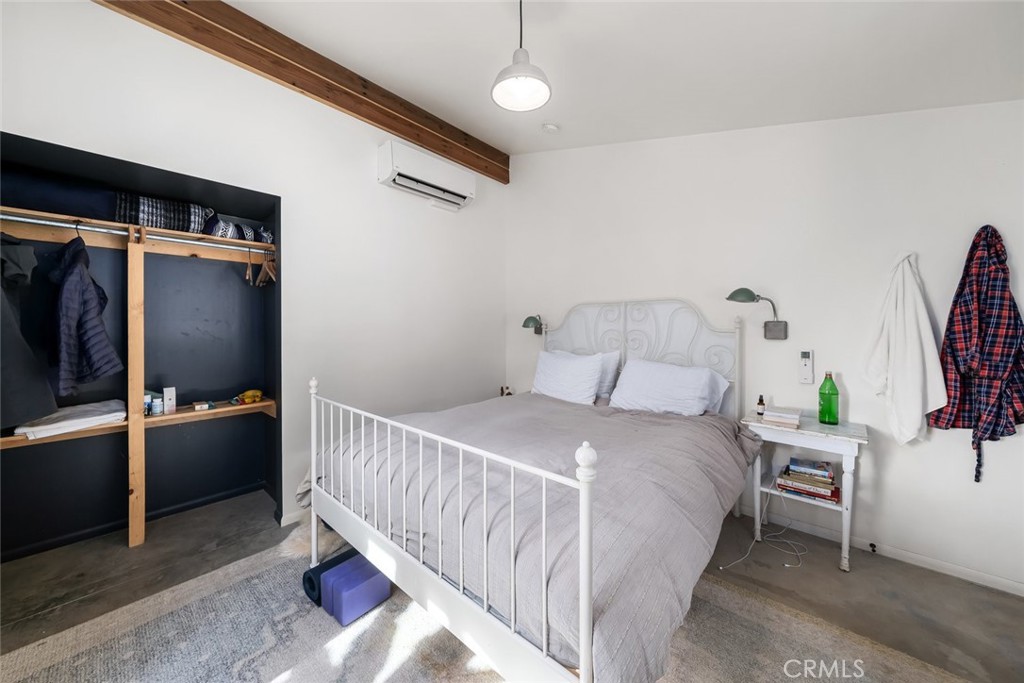 6790 West Pozo Road Santa Margarita, CA 93453 - Photo 40 of 68 a bedroom with a bed and a flat tv screen on wall