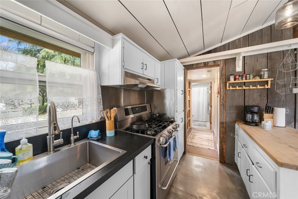 6790 West Pozo Road Santa Margarita, CA 93453 - Photo 58 of 68 a kitchen with stainless steel appliances granite countertop a sink and a refrigerator