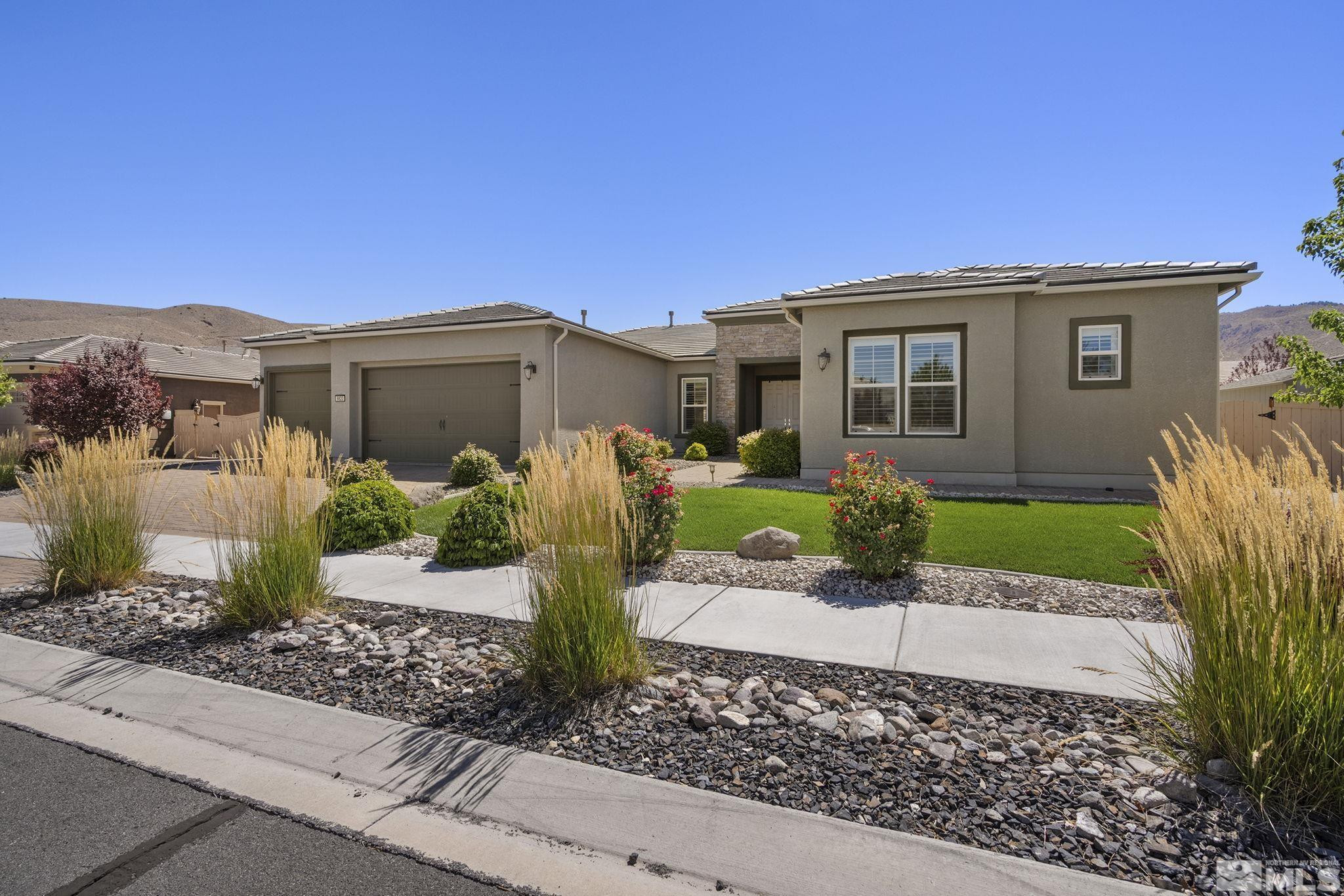 9820 Firefoot Lane Reno, NV 89521 - Photo 2 of 40 a front view of a house with garden