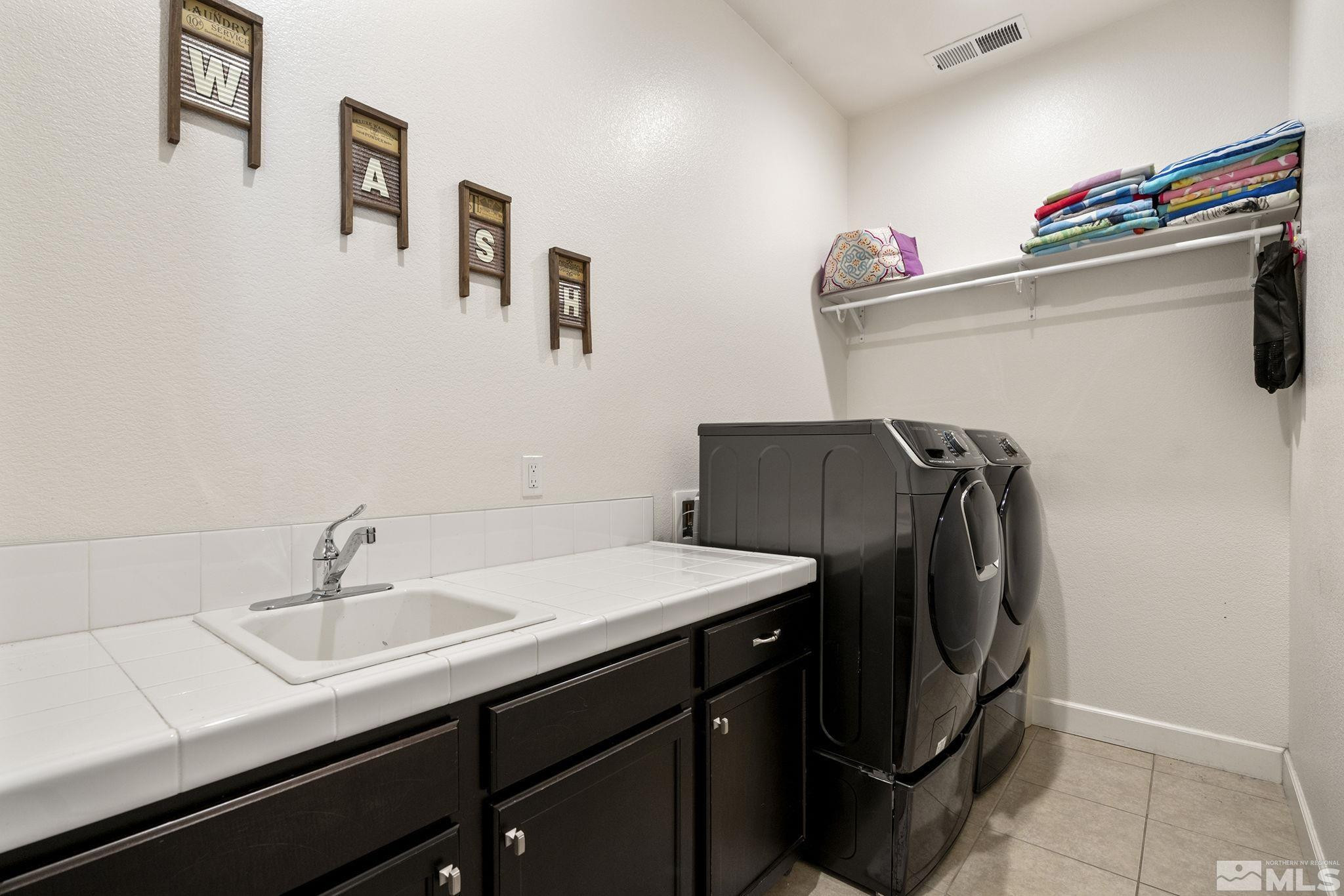 9820 Firefoot Lane Reno, NV 89521 - Photo 24 of 40 a utility room with cabinets
