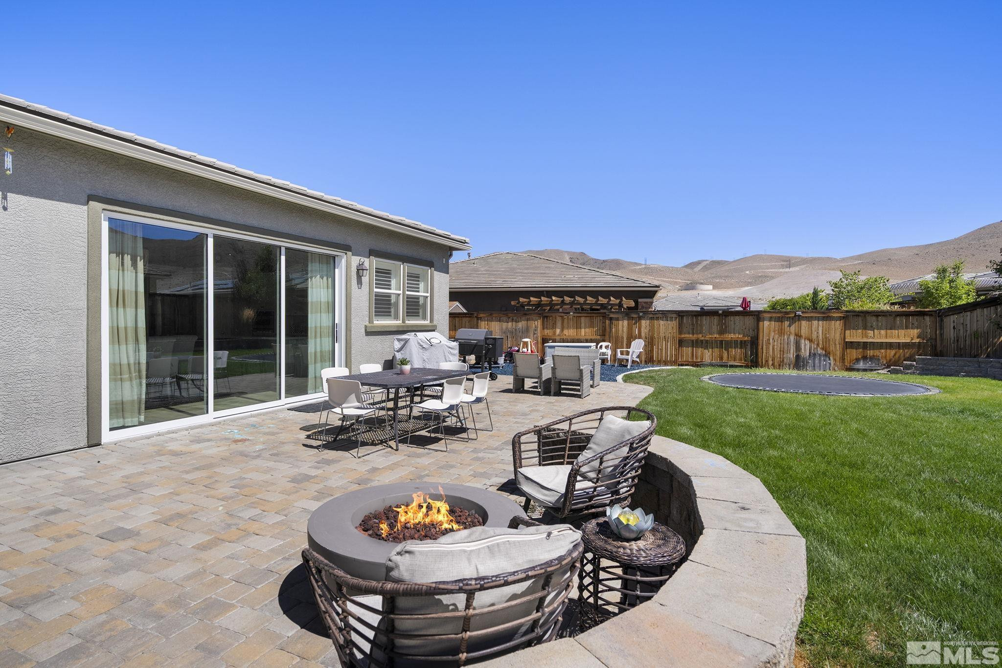 9820 Firefoot Lane Reno, NV 89521 - Photo 28 of 40 a view of a patio with couches chairs and a table and chairs
