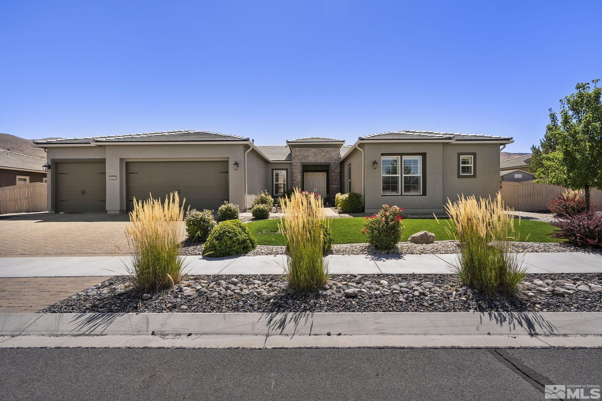 9820 Firefoot Lane Reno, NV 89521 - Photo 33 of 40 a front view of a house with garden