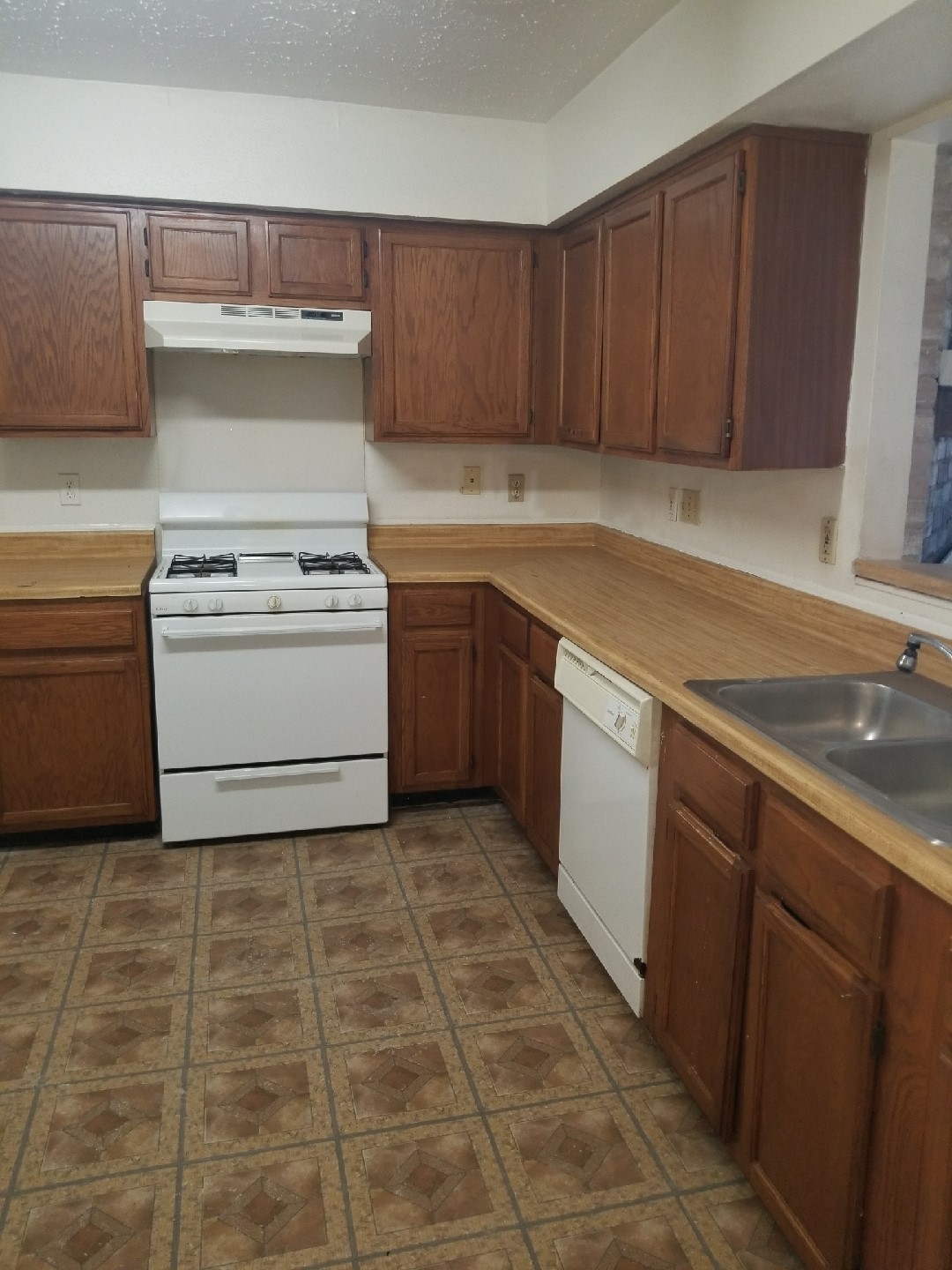 7902 Arbor Glen Road Houston, TX 77071 - Photo 6 of 9 a kitchen with a cabinets and white appliances