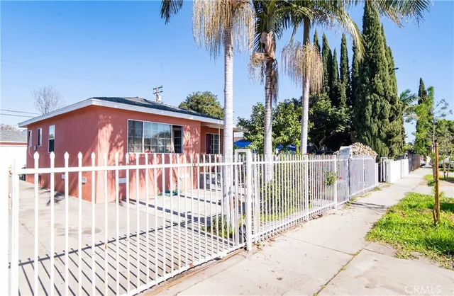 a view of a house with a small yard