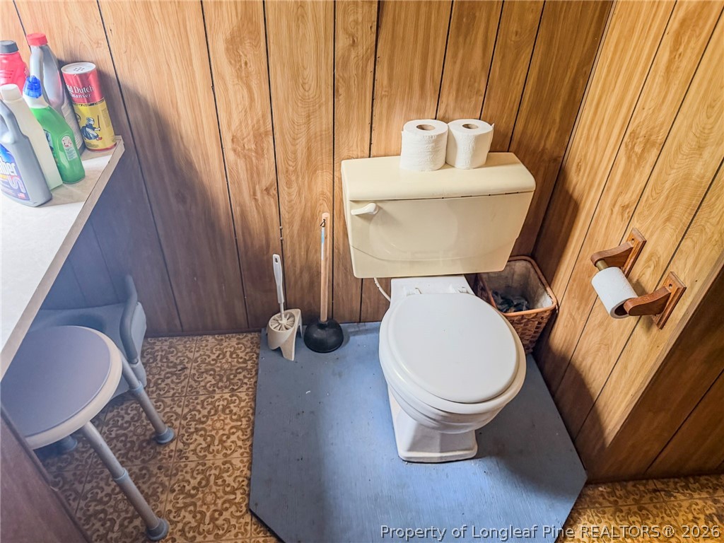 1308 Mac D Road Orrum, NC 28369 - Photo 8 of 32 a bathroom with a toilet and a sink
