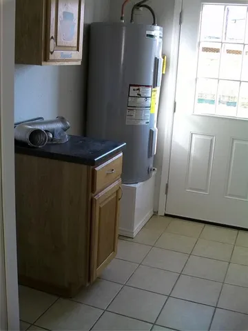 a kitchen with granite countertop a refrigerator and a stove