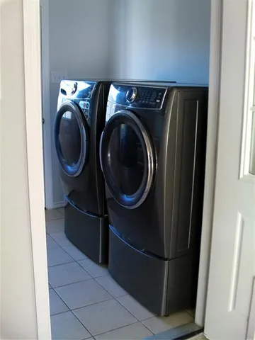 a utility room with dryer and washer
