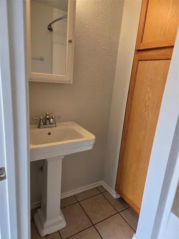 a bathroom with a sink and mirror