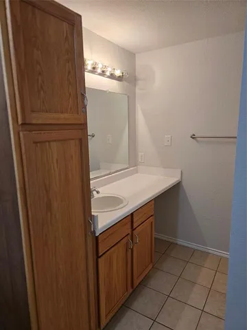 a kitchen with a refrigerator and a sink