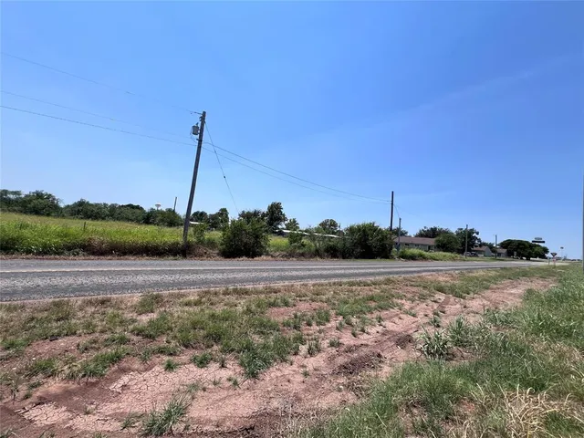 a view of a road with a yard