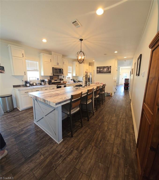 1266 Quaker Church Road Siloam, NC 27047 - Photo 1 of 29 View of gathering space