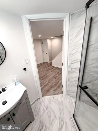 an empty room with wooden floor and closet
