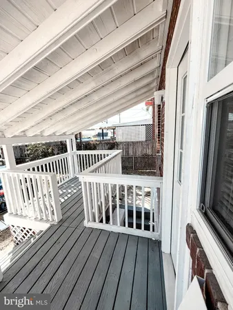 a view of a balcony with furniture